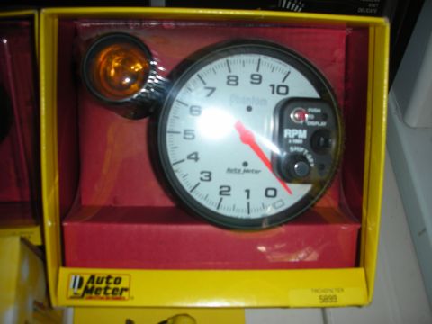 1998 Ford Crown Victoria - Auto Meter Phantom tachometer gauge, part number 5899, shown in its original packaging.