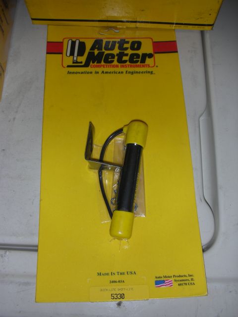 1998 Ford Crown Victoria - This Auto Meter Quick-Lite Shift Lite is packaged in yellow and includes a mounting bracket.