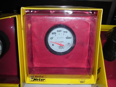 1998 Ford Crown Victoria - An Auto Meter oil pressure gauge is displayed in its retail packaging.