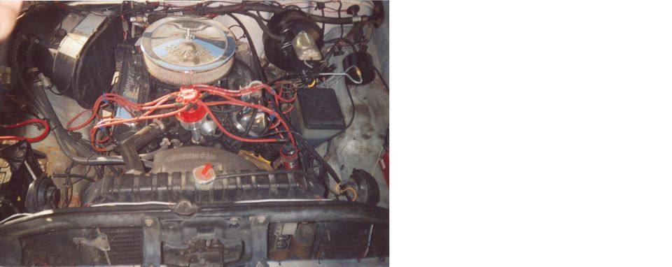 engine bay with chrome air cleaner and red spark plug wires
