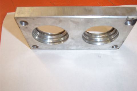 1996 Ford Bronco - This aluminum throttle body spacer features two circular openings with machined edges.