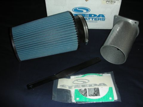 1998 Ford Crown Victoria - This image shows a Steeda air intake kit, including a blue air filter, intake tube, and installation instructions with decals.