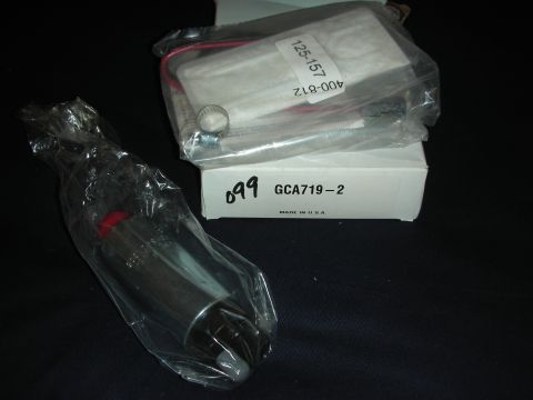 1998 Ford Crown Victoria - A new fuel pump and filter are shown in their packaging, with part numbers GCA719-2 and 125-157 visible.