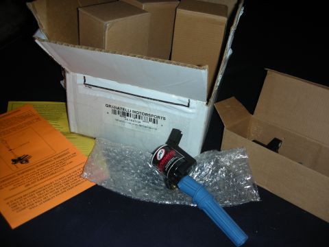1998 Ford Crown Victoria - A Granatelli Motorsports ignition coil with a blue boot sits next to its packaging and instructions.