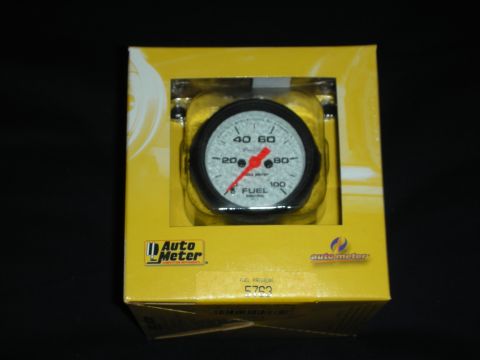 1998 Ford Crown Victoria - This Auto Meter fuel pressure gauge is shown in its original yellow retail packaging.