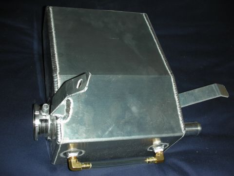 1998 Ford Crown Victoria - An aluminum coolant overflow tank with brass fittings and a mounting bracket is shown against a dark background.