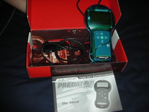 1998 Ford Crown Victoria - The DiabloSport Predator tuner and its user manual are shown, designed for Ford SVT Supercharged vehicles.