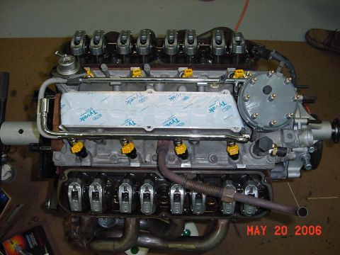1994 Ford Bronco - A V8 engine is shown on a workbench, possibly undergoing maintenance or repair.
