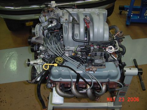 1994 Ford Bronco - Engine on stand, likely a Ford V8, with visible oil cap and Supermotors.net watermark.