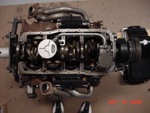 1994 Ford Bronco - Engine block with internal components exposed, showing the crankshaft and connecting rods.