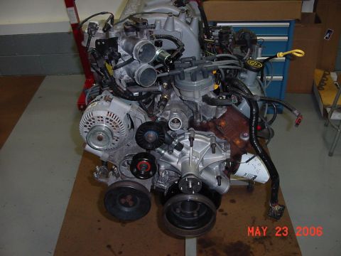 1994 Ford Bronco - This is a close-up view of a vehicle engine assembly, showing various components and wiring.