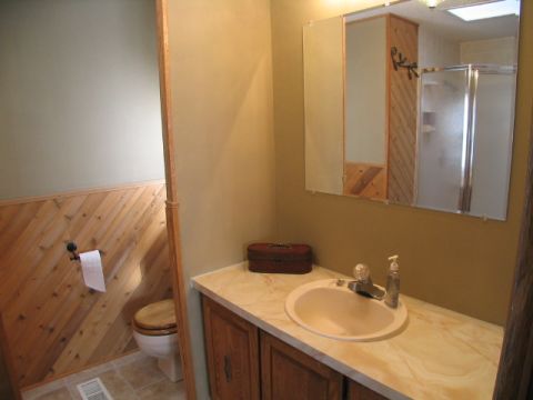 1995 Ford Bronco - Interior view of a bathroom a toilet, sink, and shower.