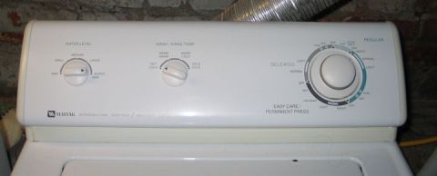 1994 Ford Bronco - Control panel of a Maytag washing machine displays various settings for water level, temperature, and cycle type.