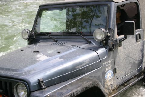 2003 Jeep TJ - 2003 Jeep TJ Wrangler navigating through a water crossing.