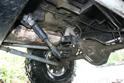 2003 Jeep TJ - Underside of a 4x4 vehicle, showing the driveshaft and differential assembly.