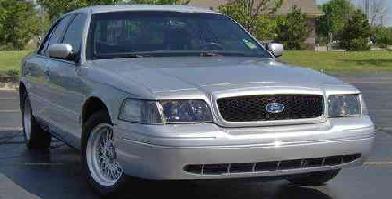 2002 Ford Crown Victoria - Front 3/4 view of a silver 2002 Ford Crown Victoria.