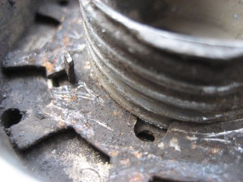 1991 Ford Bronco - This image shows a close-up of a rusty metal part, not a 1991 Ford Bronco.