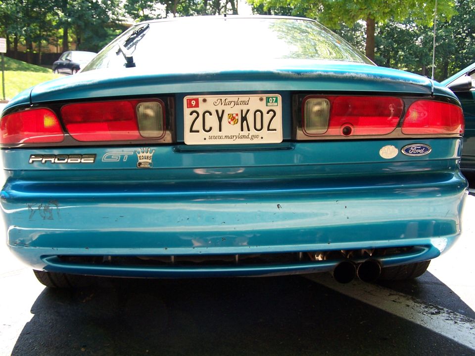 Teal 1994 Ford Probe GT with Maryland license plate 2CY K02 and dual exhaust pipes