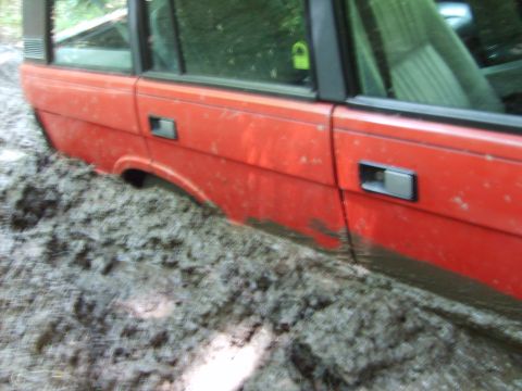 1995 Ford Bronco - stuck up to the wheel wheels