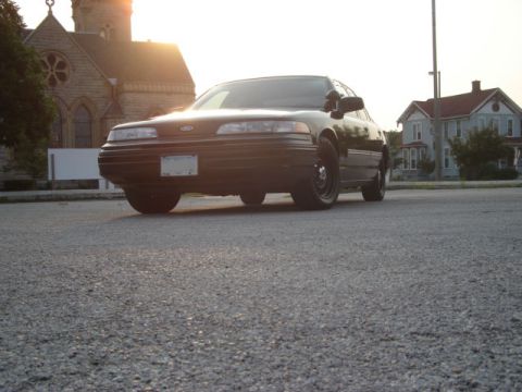 1992 Ford Crown Victoria - Front view of a 1992 Ford Crown Victoria parked on a street during the day.