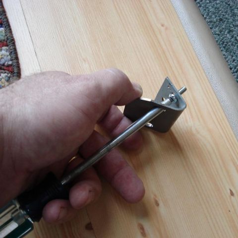 1999 Ford Crown Victoria - Had to drill larger holes for screwdrive to get access to the machine screws