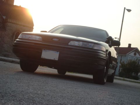 1992 Ford Crown Victoria - This 1992 Ford Crown Victoria is captured in a low-angle shot during sunset.