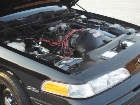 1992 Ford Crown Victoria - The engine compartment of a 1992 Ford Crown Victoria is displayed with the hood open.
