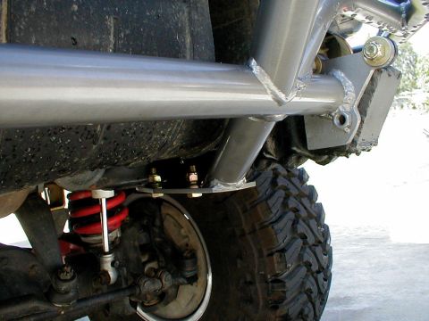 1996 Ford Bronco - Custom bumper mount assembly with suspension components and off-road tire visible.