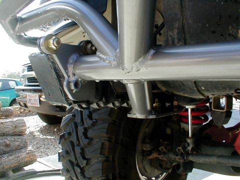 1996 Ford Bronco - Custom bumper and suspension parts are visible on a vehicle, with another car in the background.
