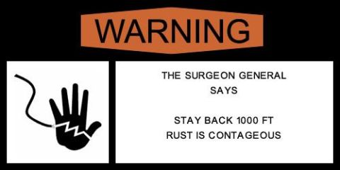 1995 Ford Bronco - A warning sign indicates that rust is contagious and advises a distance of 1000 feet.