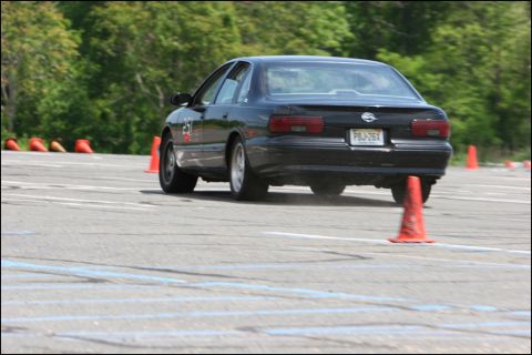 2001 Mercury Grand Marquis - A black 1994 Chevrolet Impala SS navigates an autocross course marked by orange cones.