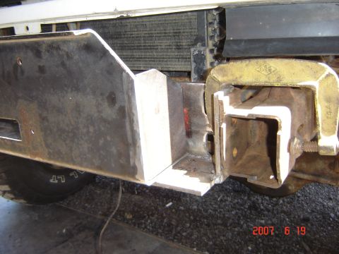 1993 Ford Bronco - Custom front bumper fabrication in progress, secured with a C-clamp.