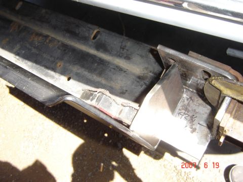 1993 Ford Bronco - Welding a custom bracket onto a vehicle's frame, likely for modification.