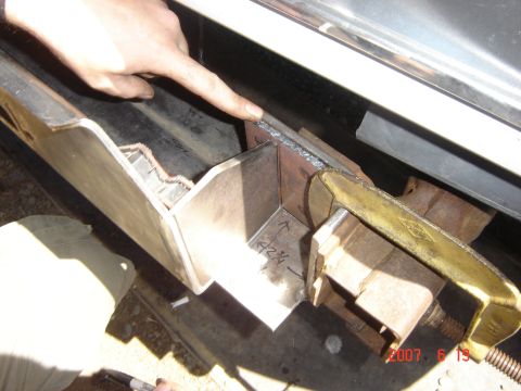 1993 Ford Bronco - Close-up of custom bumper fabrication, showing metalwork and measurements.