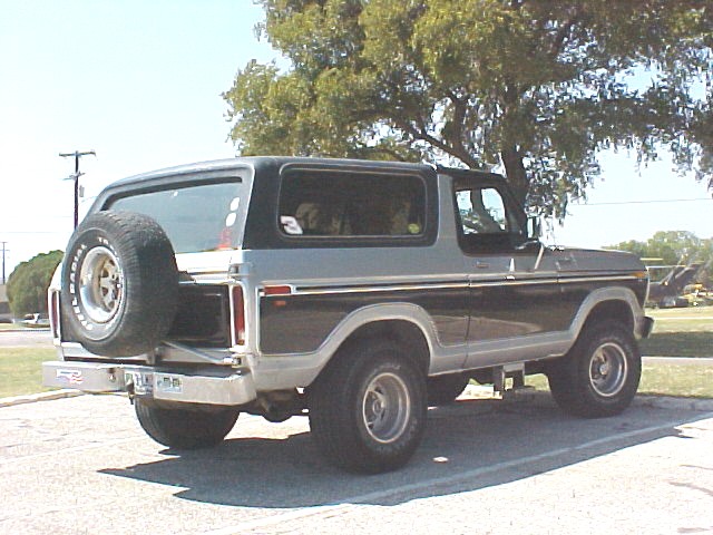 Two-tone gray and black SUV, rear view with spare tire. Appears to be a 1978 model