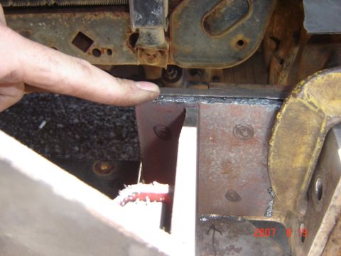1993 Ford Bronco - A close-up view of rusted metal components, possibly from a vehicle's undercarriage.