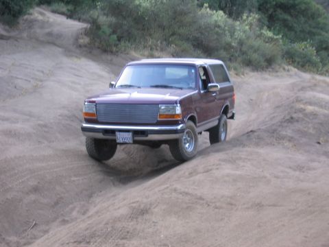 1996 Ford Bronco - This 1996 Ford Bronco navigates a dusty off-road path.