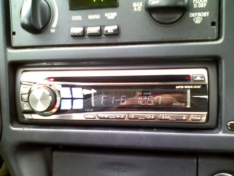 1995 Ford Thunderbird - An aftermarket stereo is installed in the dashboard of this vehicle, displaying the radio station frequency.