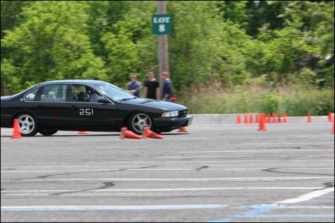2001 Mercury Grand Marquis - A black sedan participates in an autocross event, marked with the number 251.