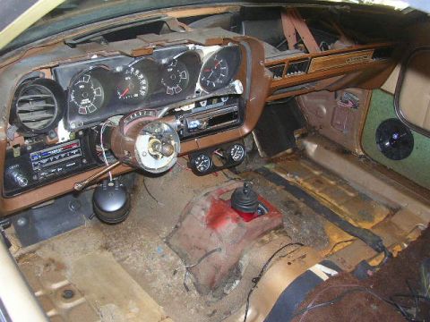 1975 Ford Ranchero - The interior of a 1975 Ford Ranchero shows its dashboard, steering column, and floor, indicating a project or restoration project.
