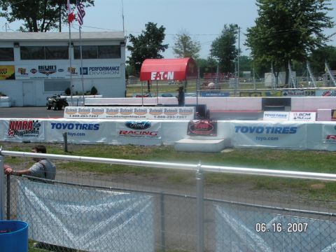 1988 Ford Mustang - A drag strip event is underway with various sponsor banners displayed along the track. The date 06 16 2007 is visible.