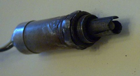 1993 Ford Taurus - This is a close-up view of an automotive oxygen sensor, a critical component for engine performance.