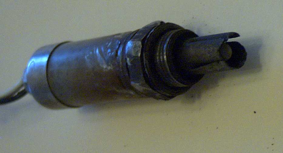 Removed oxygen sensor with badly corroded threads and eroded slotted tip shield