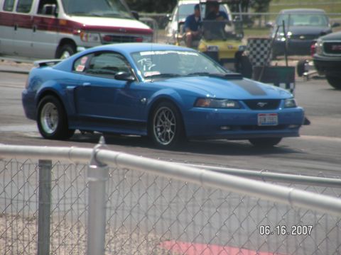 1988 Ford Mustang - Blue Ford Mustang with racing stripes on a track, seen on 06/16/2007.