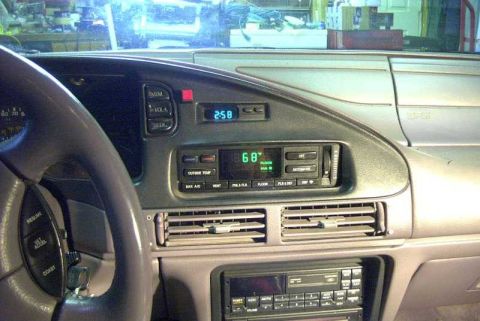 1993 Ford Taurus - Interior view of a car's dashboard, showing the steering wheel and center console.