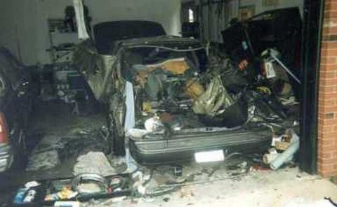 1993 Ford Taurus - The interior of a car is visible, showing significant damage and disarray.