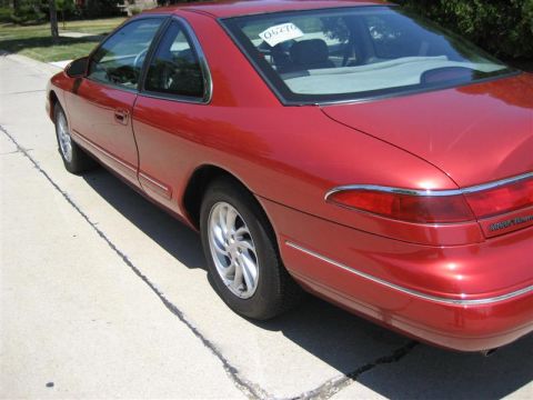 1996 Lincoln Mark VIII - This 1996 Lincoln Mark VIII is shown from the rear 3/4 angle. A sticker with the number 06270 is visible on the rear window.