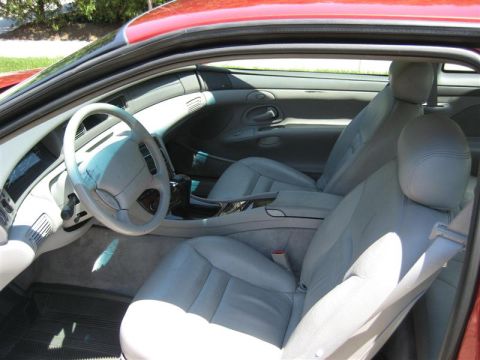1996 Lincoln Mark VIII - The interior of a 1996 Lincoln Mark VIII features light gray leather seats and a clean dashboard.