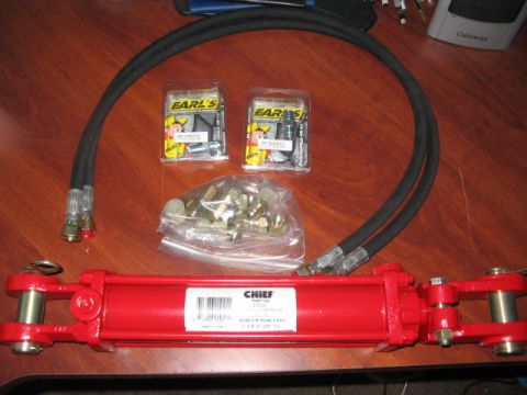 1991 Ford Bronco - Hydraulic cylinder and hoses, likely for automotive or industrial use.