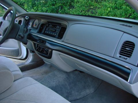 1997 Mercury Grand Marquis - Interior view of a 1997 Mercury Grand Marquis, showing the dashboard and front passenger area.